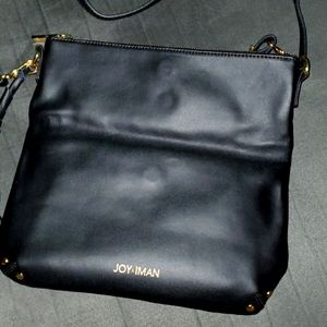 Joy & Iman adjustable black leather purse with cotton lining